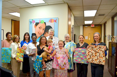 Dr. Joan Richardson and Gartee family with blankets.