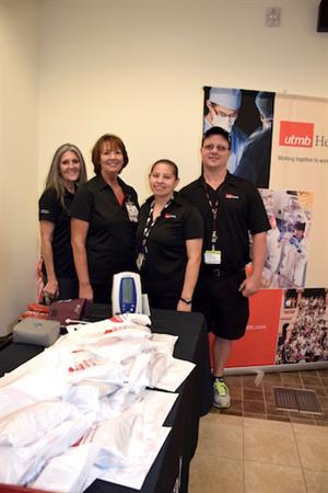 Visor (left) with ADC colleagues Cheryl Vining, Irene Vidana and Michael Washburn at a health fair in Pearland.