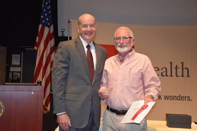 Dr. Randall Goldblum received special recognition from UTMB President David Callender for his 45 years of service.