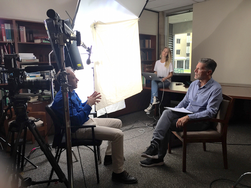 Rakez Kayed, PhD, (left) does an interview with journalist Stone Phillips about cutting-edge neurodegenerative research being done at UTMB.