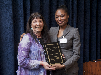 Kathlynn Joel-Reich, winner of the 2014 Community Service Award with Adeola Oduwole, director Diversity and Inclusion.