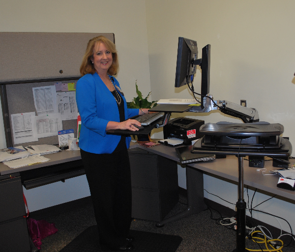 UTMB Senior Communications Specialist Mary Ann Hellinghausen began using a sit-to-stand workstation. 
