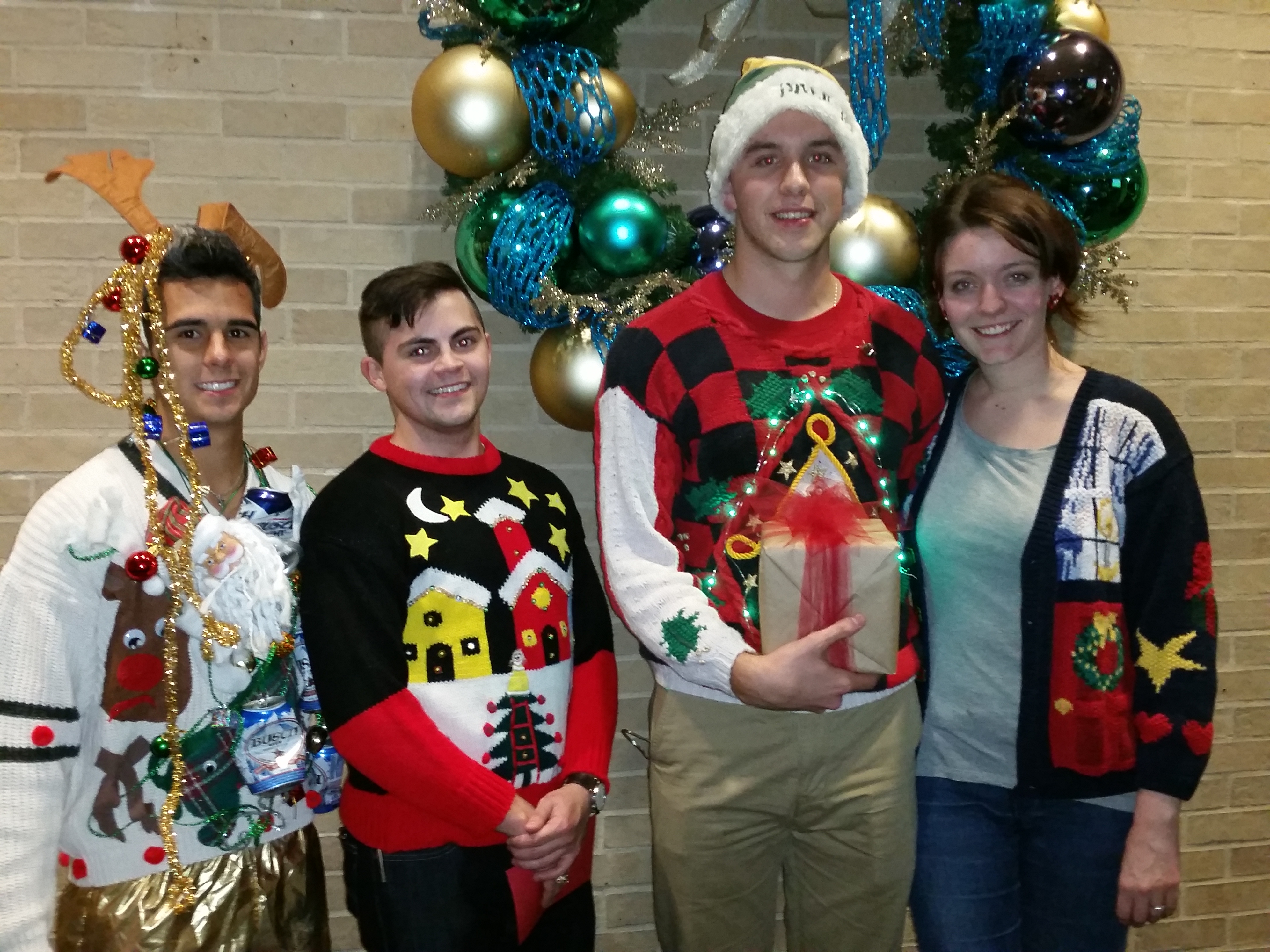 From left to right: James Gwosdz (2nd place), Andrew DeCrescenzo (3rd place), and 1st Place Winner Ryan Gates and guest.