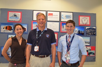 Dr. Scott Parazynski, director of the Center for Polar Medical Operations at UTMB, is flanked by aerospace medicine residents Drs. Natacha Chough and James Pattarini