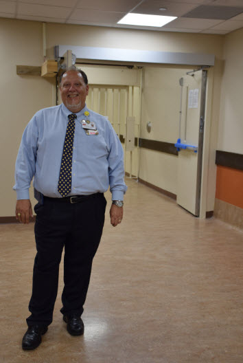 Hicks stands near the 4th floor entrance to Hospital Galveston