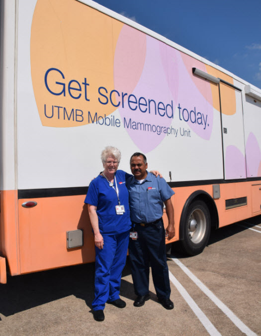 Madeline Goldenschue, a mammographer at UTMB, and José Martinez standing outside the Mobile Mammography Unit on a day they worked in Pearland.