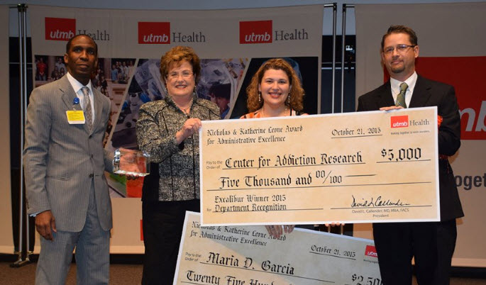 Steven Baines, Human Resources Talent and Organizational Development; Donna Sollenberger, CEO of UTMB Health System; winner Maria D. Garcia; Jonathan Hommel, PhD, assistant professor of Pharmacology, representing the Center for Addiction Research.