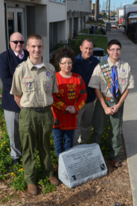 Friends join James Lusby-Garcia, far right, at the site of his late grandmother's memory garden. From left, they are David Ketchens of UTMB; fellow Scout member Brandon Leasure; James' mother, Jamie Lusby; and Tim Schilling of UTMB.