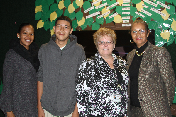 A phone call from 12 year-old Miguel Gonzales, pictured with his teacher Ashley Williams, UTMB’s Joan Nichols and principal Patricia Williams, resulted in a new collaboration between the Galveston National Lab and Ambassadors Preparatory Academy.