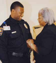  New UTMB Police Department Sergeant Ronnie Johnson, left, is pinned at his promotion ceremony by his mother, Margaret Johnson.