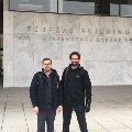 Two people stand outside the Federal Building at 800 Independence Avenue SW.