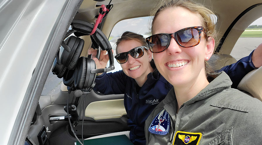 Two female pilots in a Cirrus SR22 aircraft.