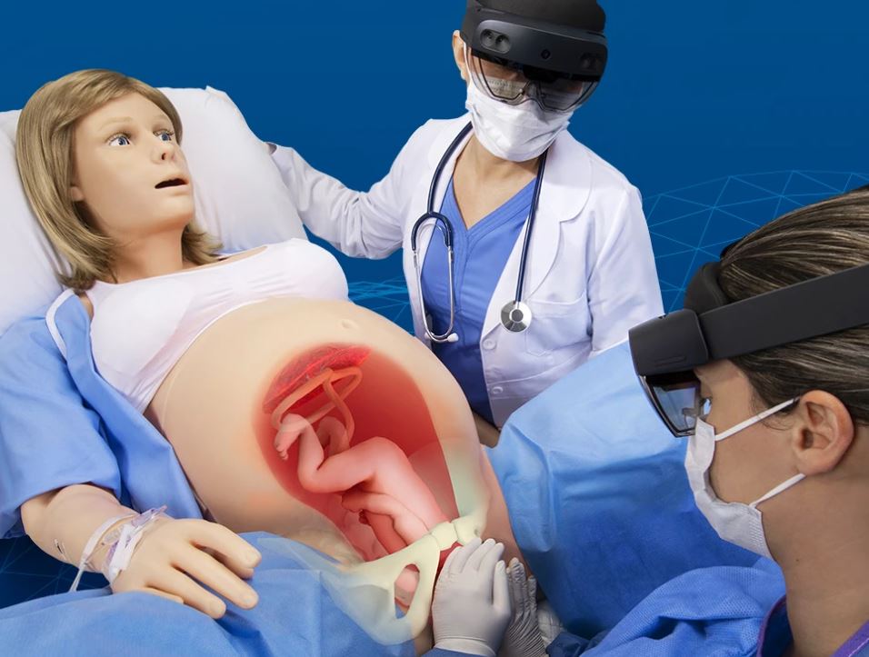 Student uses Microsoft HoloLens headset during a medical simulation exercise at UTMB Simulation Center, interacting with augmented reality visuals in a clinical training environment.