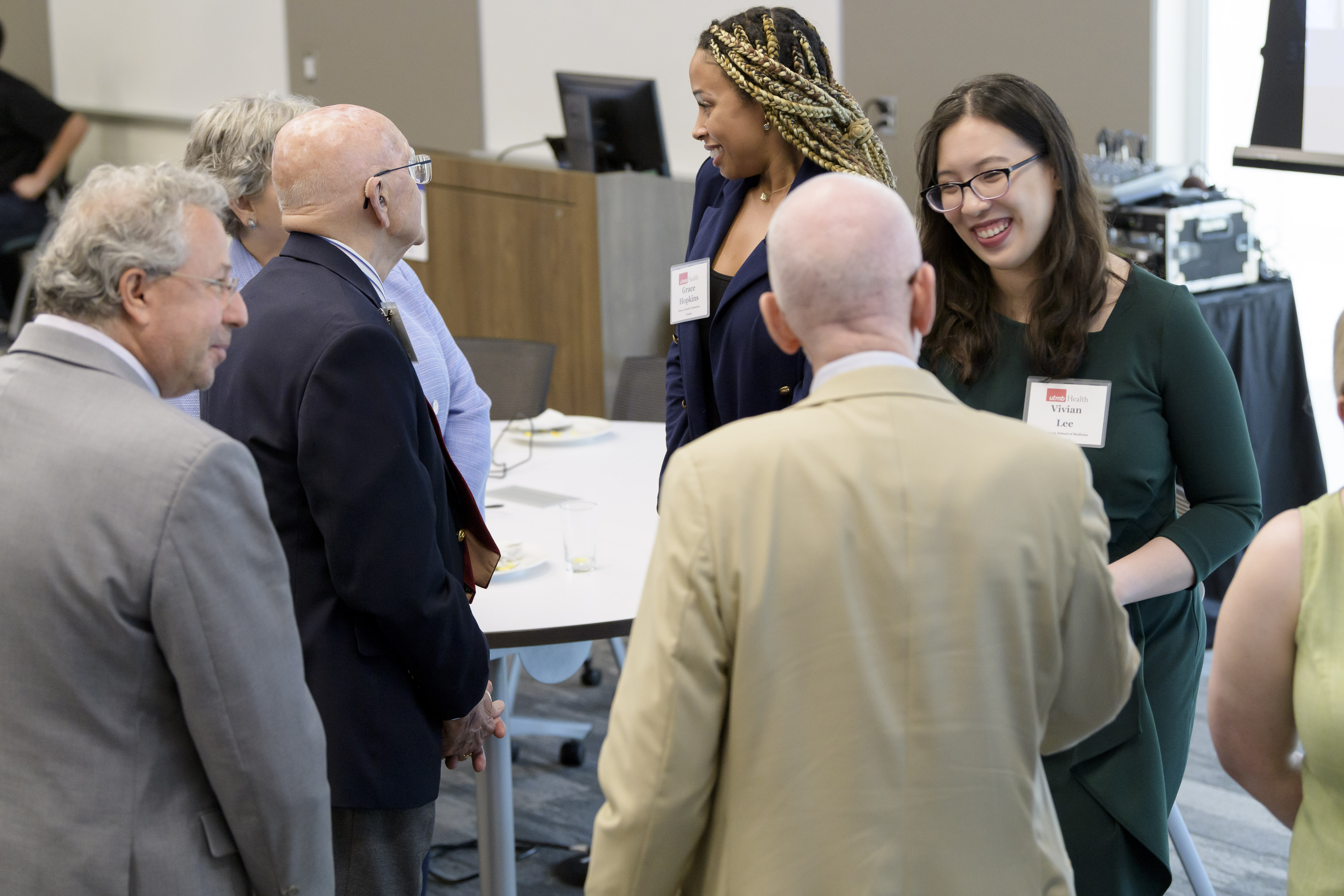 Agroupofpeoplesocializingatthe2024DevelopmentBoardAnnualMeeting