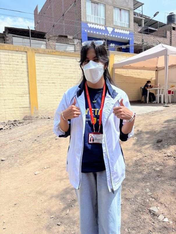 student posing for a photo while wearing a clinical face mask 