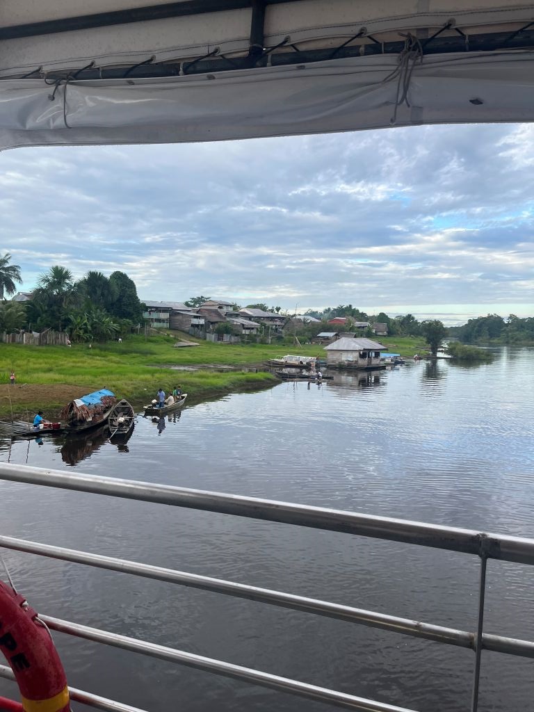 View from medical boat looking out over riverside village.
