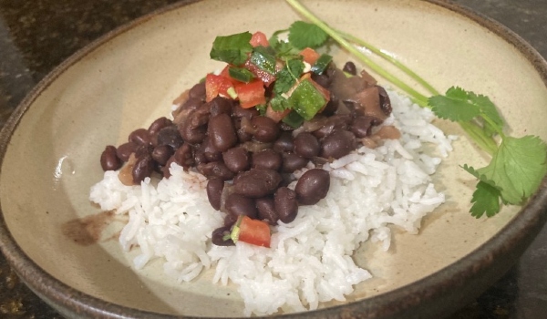 Photo of black beans over rice