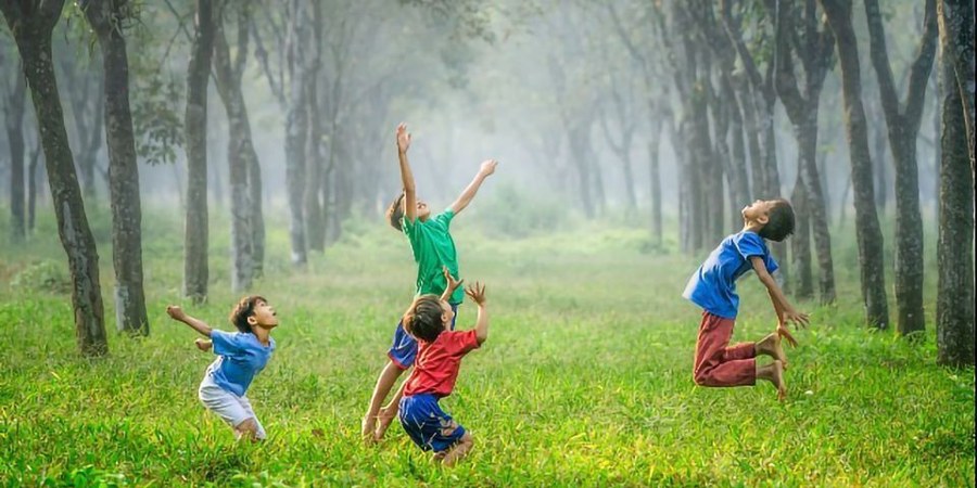 Photo of children playing in field