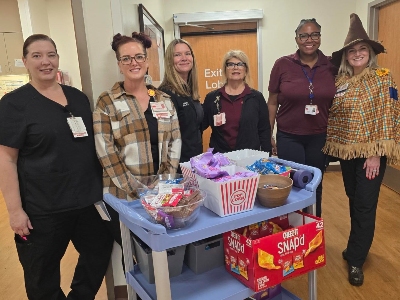 Image of people in costume with snack cart