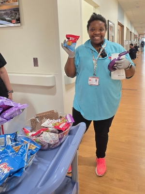Image of woman in scrubs with snacks