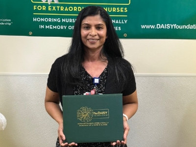 Nurse holding certificate