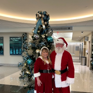 Image of couple in Santa outfits