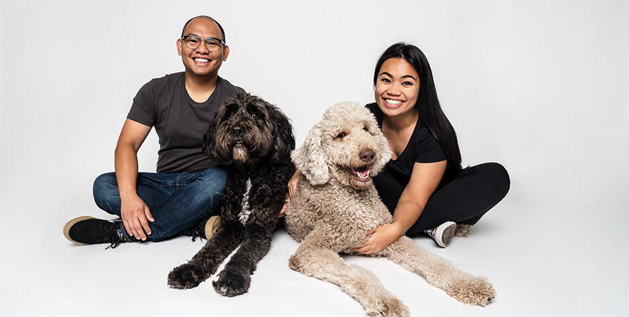 Juncel Arpon, is pictured with his wife, Anjouli, and fur babies, Hooper, left, and Coffee.
