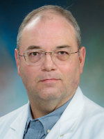 Professional headshot of male doctor