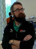 Photo of man with arms crossed