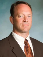 Headshot of man in suit