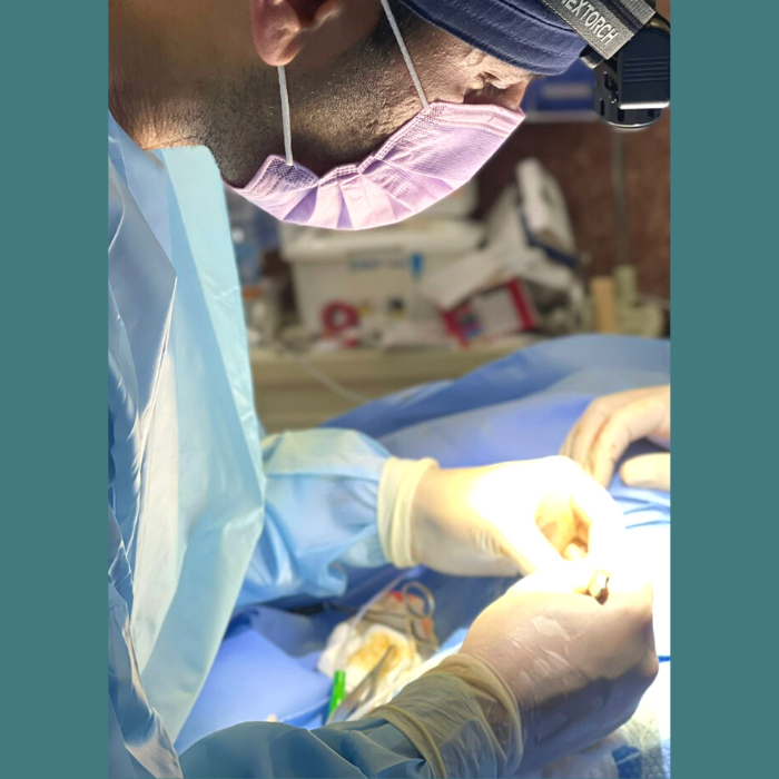 Dr. Farhan performing surgery