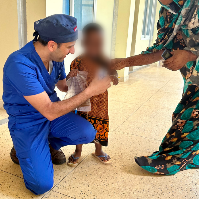 Dr. Farhan in Tanzania with pediatric patient