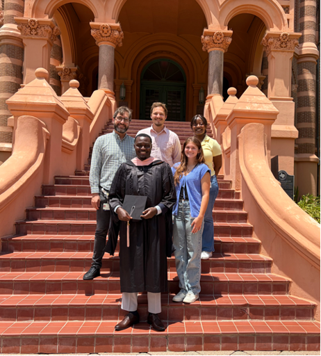 diverse group of researchers in front of Old Red at UTMB
