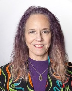 woman smiling in a studio setting