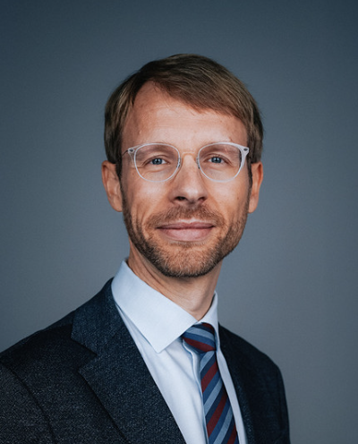 man wearing a tie and glasses