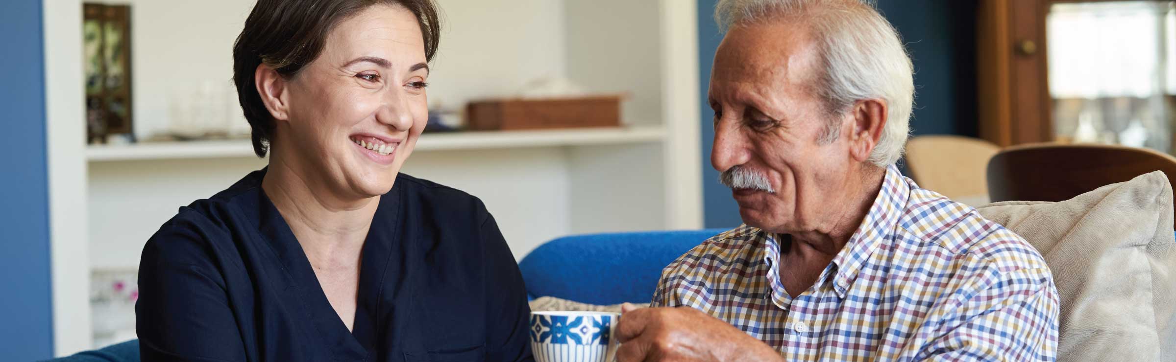 older man and woman, a caregiver with a male patient