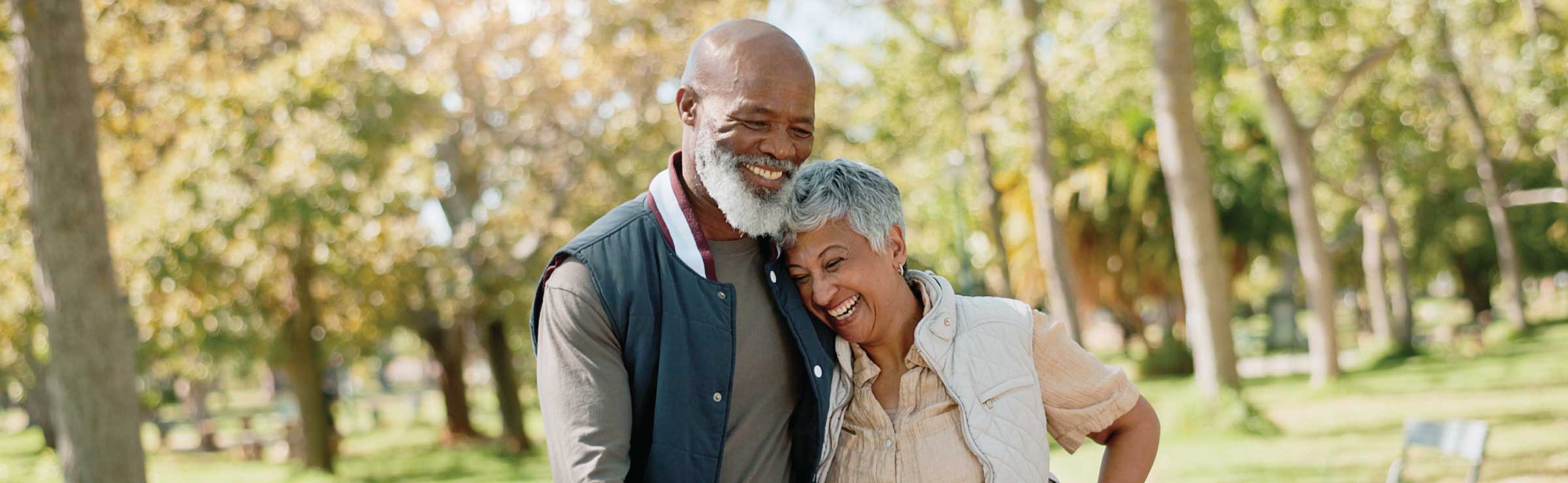 older adult couple of color walking outdoors