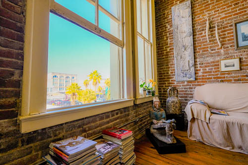 Ulli Budelmann interior of home looking out of a window