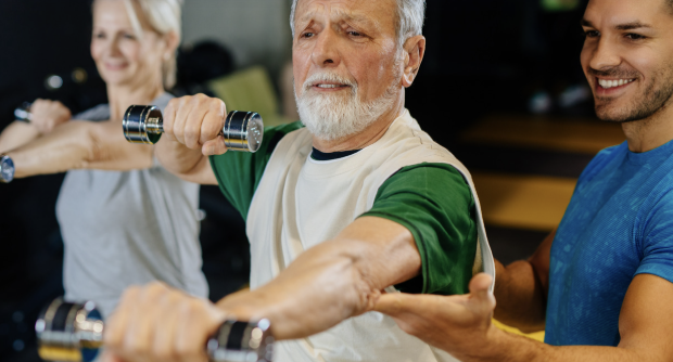 older adults exercising with a trainer