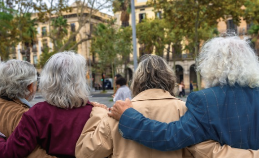 group of older women embracing outdoors