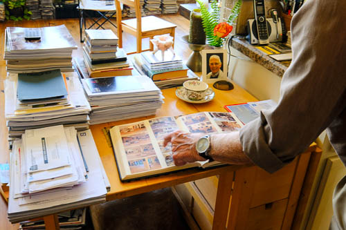 Ulli Budelmann a person points to a page in a book
