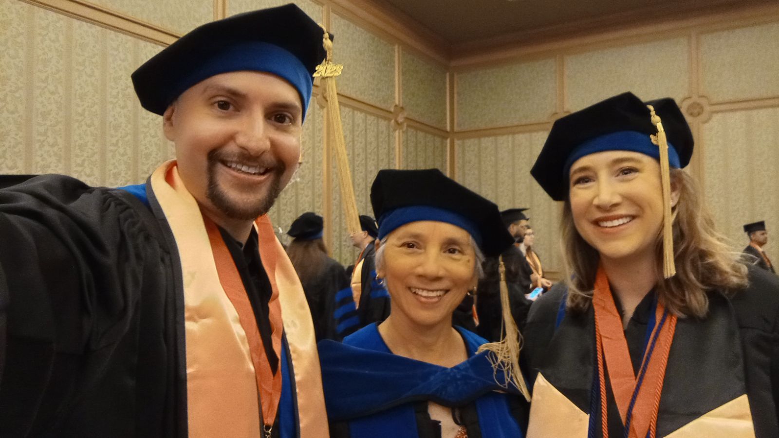 Robert Rodriguez, Rebeca Wong, and Paige Downer attending commencement