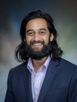 Professional headshot of Ahmar Hashmi