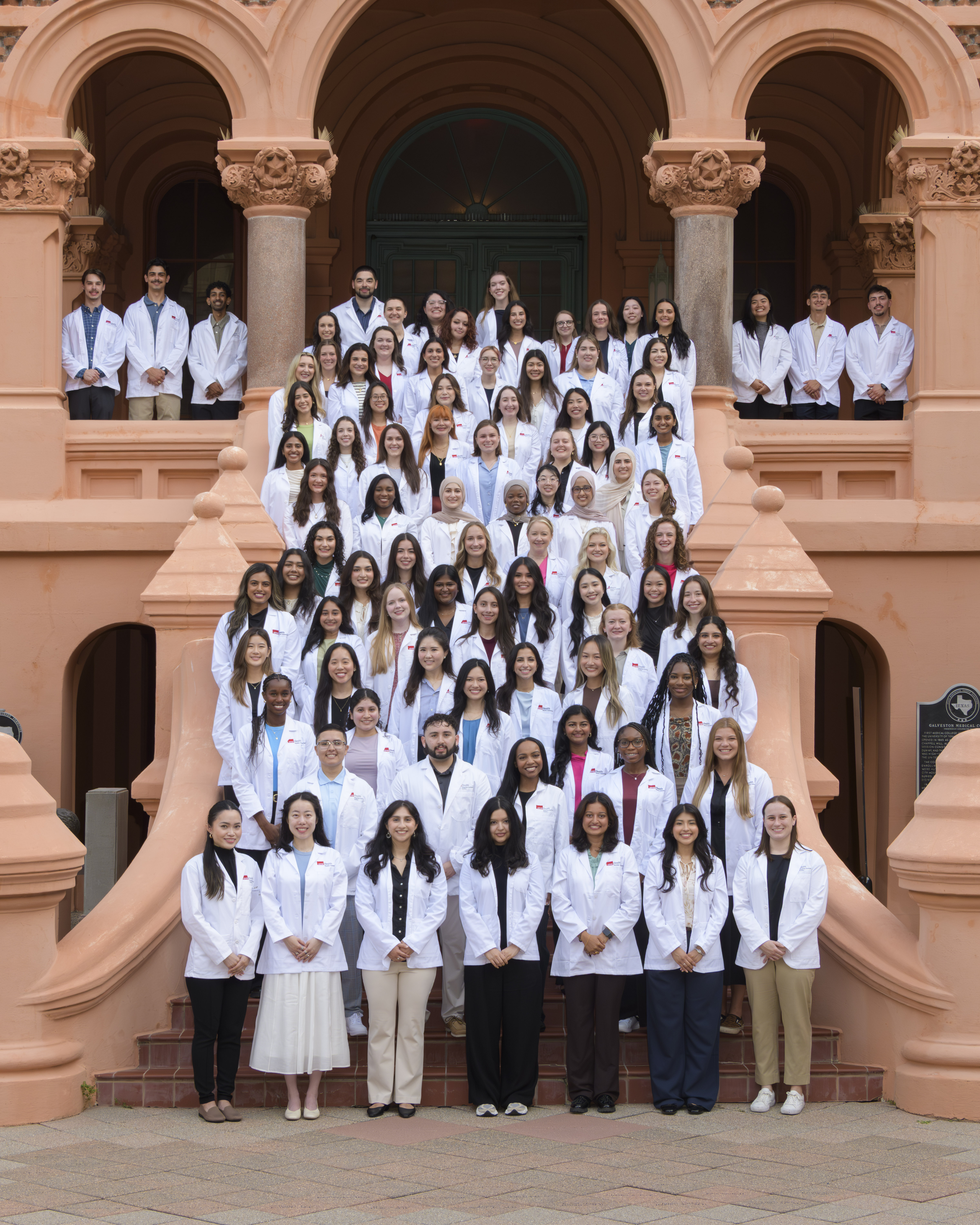 Group picture of PAS Class of 2026 in front of the Ashbel Smith building, aka Old Red.
