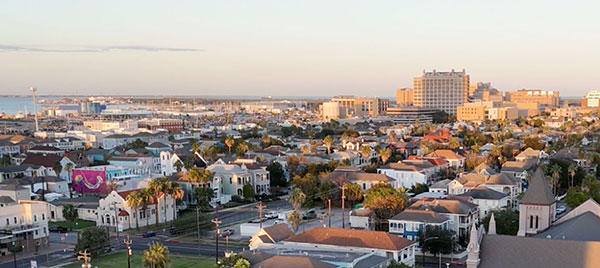 A wide shot overlooking homes and businesses in Galveston