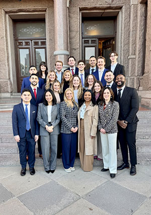 UTMB CRNA students and leaders pose in a group in front of the Texas State Capitol