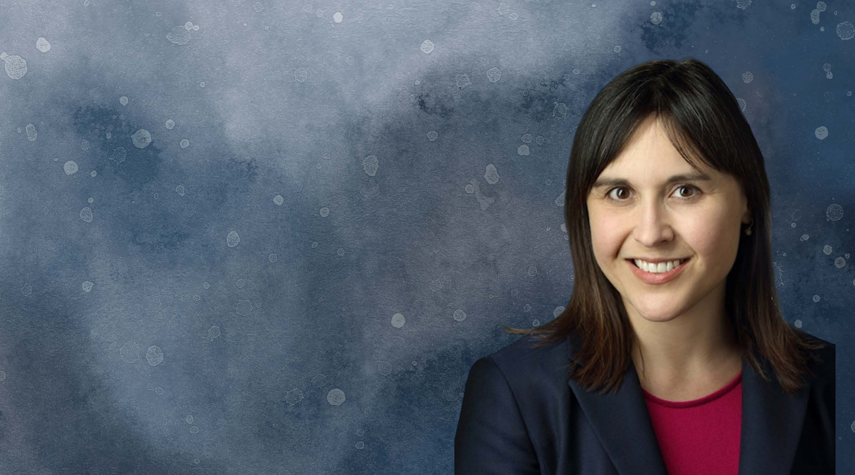 Presenter Rachel Walden; she is a Caucasian female in her 30s with straight black shoulder length hair, oval face, pointed chin, smile, in a dark blue blazer.