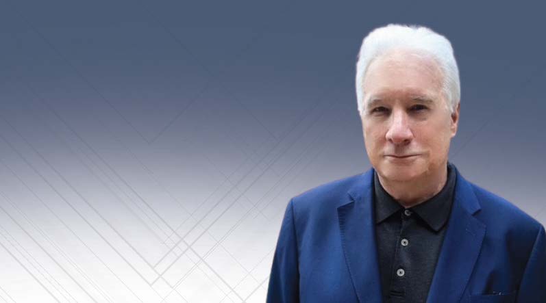 Karl Kellar: Caucasian man in his late 50s-early 60s with white short hair and eyebrows, large nos. He is wearing a dark blue button up and a vibrant blue jacket.