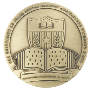Medal featuring University of Texas System emblem with an open book, a star, and laurels. Inscribed with "The University of Texas System Regents Outstanding Teaching Award" around the edge.