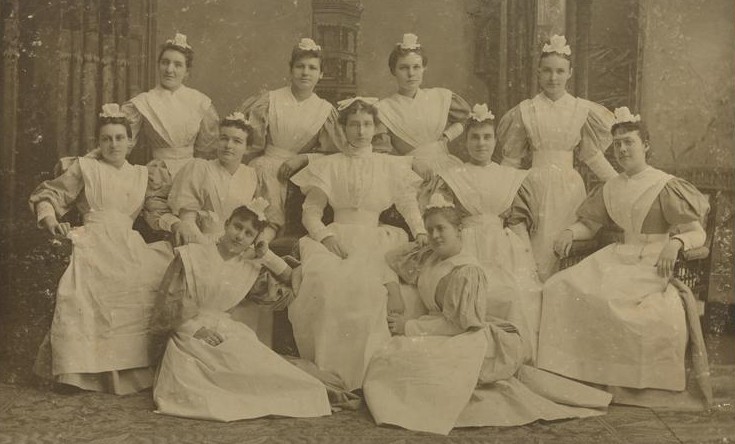 A photo from 1895 depicting nurses in white uniforms